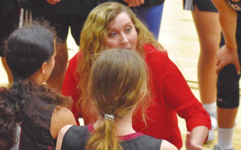 Watonga girls coach Lauren Campo gives her team instruction during a break in play.