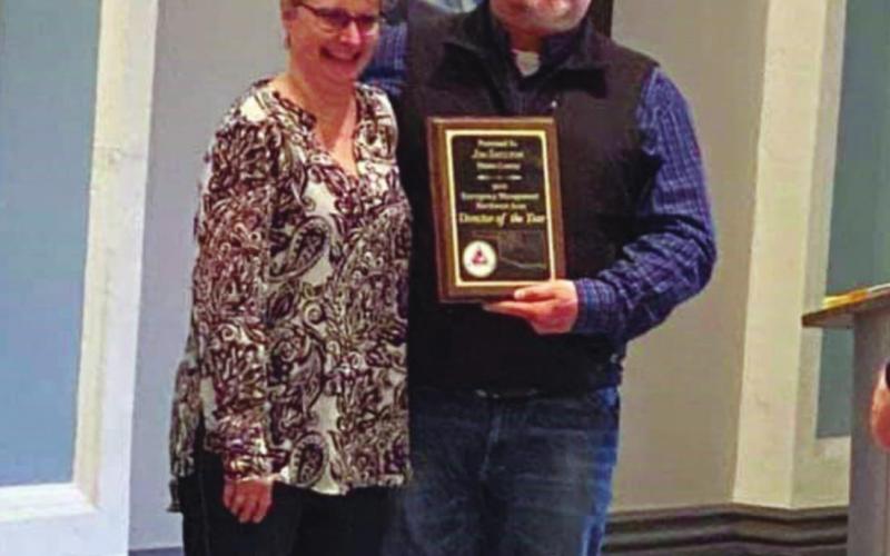Jim Shelton, Blaine County Emergency Manager, accepts a plaque from Lynn Gould. Shelton was awarded March 5 as the Northwestern Oklahoma Emergency Manager of the Year at the Northwestern Oklahoma Emergency Management Workshop in Enid. He will go on to compete for the state award, which will be made in August. Lynn Gould I Watonga Republican