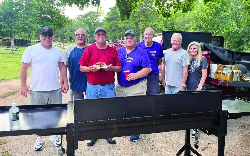 The Lions Club held a cookout Monday at Roman Nose State Park for the teachers, administrators and staff of Watonga Public Schools. Shown are (L to R) Superintendent Kyle Hitlerbran and Lions Donnie Dunn, Steve House, Rex Kraft, Gary Olsen, and Tim and Sheri Nelson.
