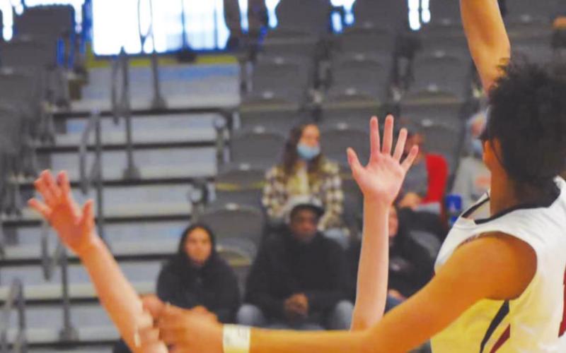 Kiylah Cooper skies high for two points in the Lady Eagles 51-31 win over OBA.