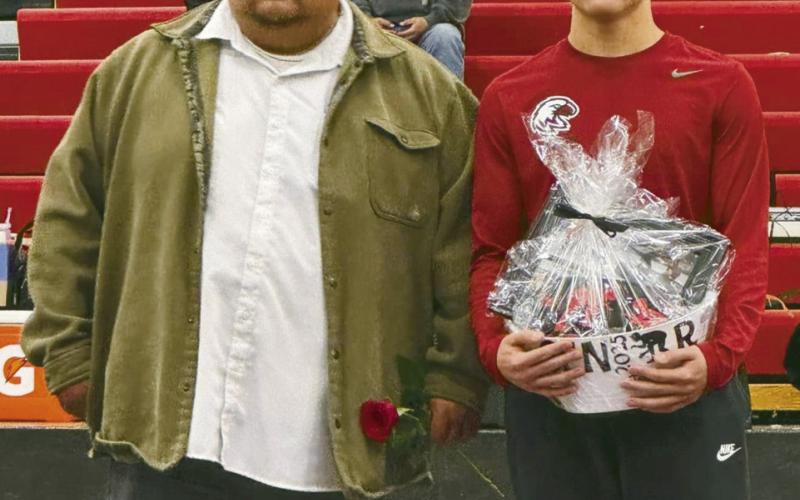 BELOW AT RIGHT : Happy Shortman, team manager
