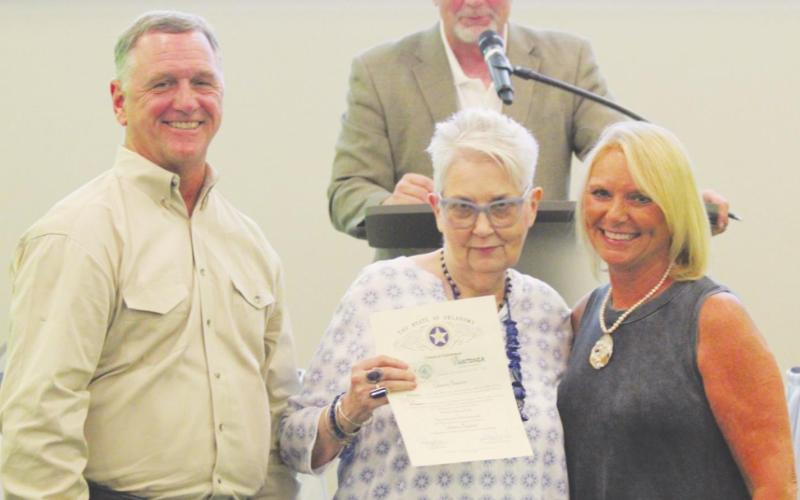 Montie Stewart presents Patt Curtin (center) and Marie Tech (right) with the 2020 Business Beautification of the Year award during the Watonga Chamber of Commerce banquet on Monday, Aug. 30, 2021.