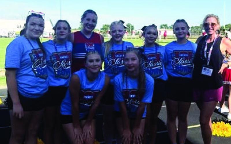 (AT RIGHT) The CHS cheerleaders spent Saturday in Woodward at the K101 Classic Bowl. They arrived early to start learning a halftime routine that was performed with 200+ other cheerleaders during the football game that evening. Nadia Luna was chosen as an honor squad cheerleader and also cheered at the Classic Bowl football game. The cheerleaders also walked in the Classic Bowl parade and showed their American spirit! Great job TIGERS!
