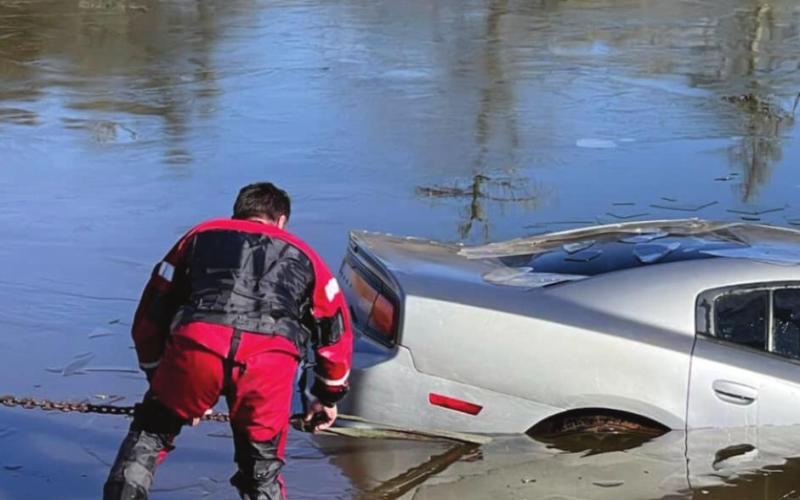 Inclement Weather Sends Car Into Geary Pond