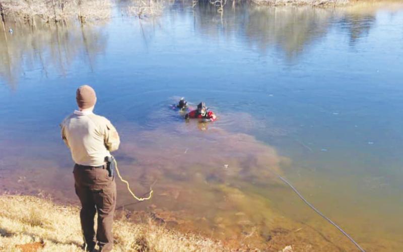 Inclement Weather Sends Car Into Geary Pond