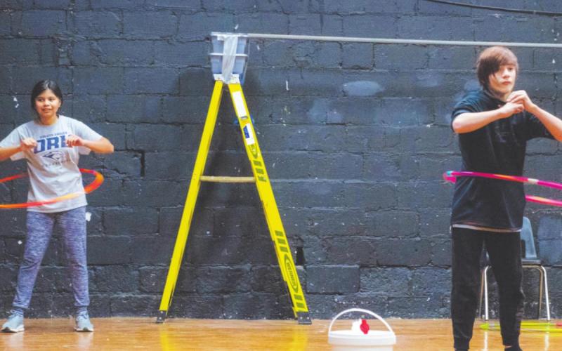 Jacks Bates (left) and Nathaniel Woods (right) compete to see who can hula hoop the longest. (Photo provided)