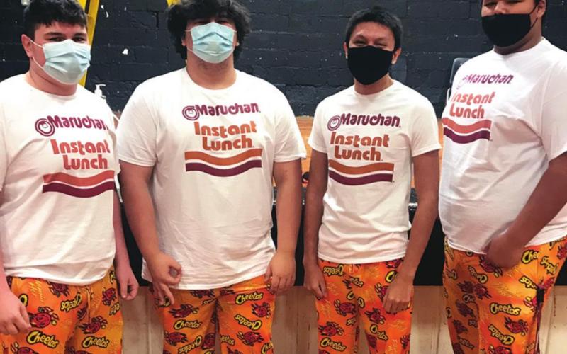 Senior students (from left to right) Tony Davidson, Arthur Lorentz, Michael Blackcrow and Izzy Yellowfish show off their school spirit on Twinkie Day.(Photo provided)