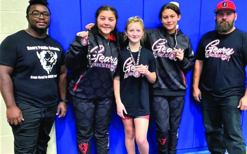 Geary Jh/Hs girls’ wrestling competed in the Holly Howard Memorial Tournament on November 21. Elliott Harrall, Olivia Helmer, and Madison Evey all placed 2nd in their weight class. Showing their tournament medals are (L-R) Elliott Harrall, Olivia Helmer, and Madison Evey.