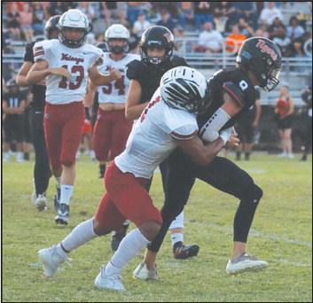 Chris Sanders tackles a Crescent player.
