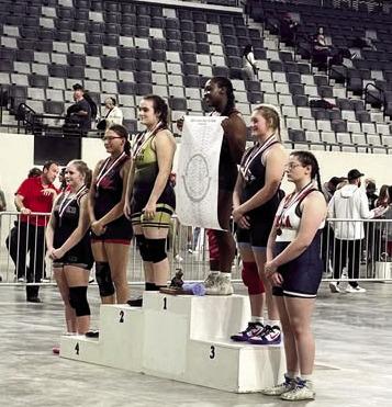 (ABOVE AND AT RIGHT) Madison Evey placed fourth at the junior high state wrestling championships. There were 33 girls in her bracket. She had a great tournament.