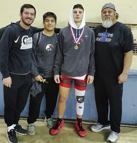 Coach Grant Williams, Ernesto Duenez, Tristian Dobbins and Jason Dobbins at the All State Wrestling Meet in Oklahoma City.