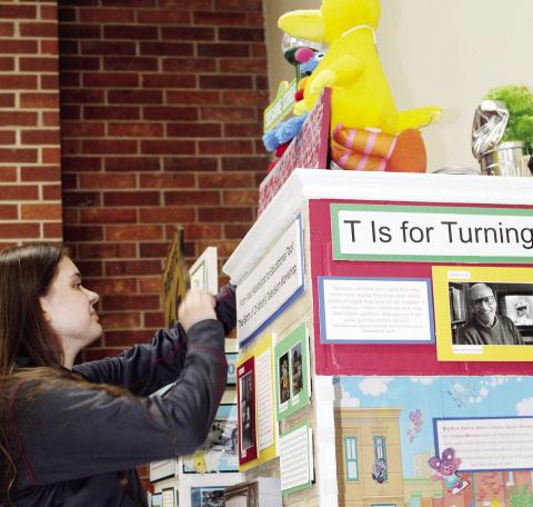 Hannah Hoffman works on her display so that photos may be sent to the sponsors of her $1,000 Prize for winning the National History Day Competition in College Park Maryland. Photo by Connie Burcham