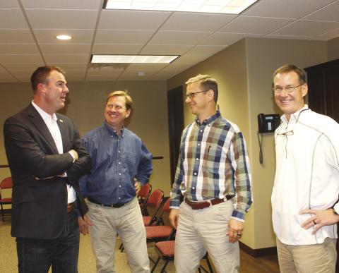 Gov. Kevin Stitt stopped Oct. 28 in Watonga where he held a meet and greet with supporters. Shown (L to R) are Stitt, Todd Lafferty, Ladd Lafferty and Austin Lafferty. The Lafferty family runs Wheeler Brothers in Watonga and hosted the governor’s entourage while in town.