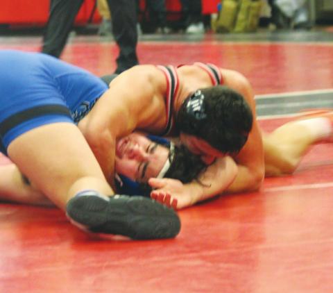 (Above) Geary High School 182-pound varsity senior wrestler Landon Holt pins opponent Shane Lundy of Bridge Creek High School on Feb. 21 in a first-round matchup at the 2020 Class 3A Regional Wrestling Tournament held at Stegall-Long Fieldhouse in Geary. Andrew Salmi | The Geary Star