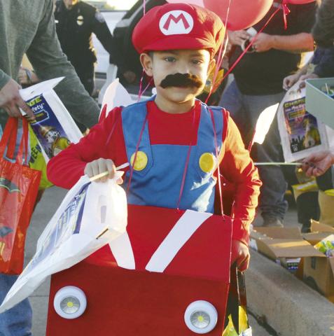 It was all fun and games, candy and make believe at Huff Lorang Park on Oct. 30 for Trunk or Treat. Shown are just a few of the cute kids who came out for the festivities. (ABOVE)Mario was a very popular costume this year. (AT RIGHT) This little