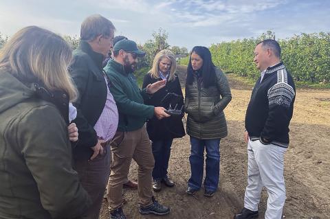 Oklahoma’s Secretary of Agriculture, Blayne Arthur, 9Secnd from right) discusses drone usage for agricultural applications during a tour of the United Kingdon in 2021.