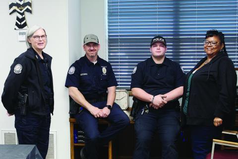 Chief of Police Beth Massey poses Friday with officers Monty Goodwin, Kagan Rinehart and dispatcher and office manager Anitra Harper. The occassion was the open house at the newly remodeled Watonga Police Department.