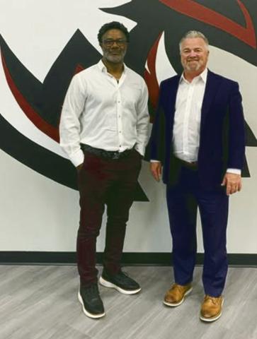 Greg Johnson poses Monday with Watonga Superintendent Kyle Hilterbran. Johnson, a member of the Watonga Football Hall of Fame, has been named head football coach for the Eagles.