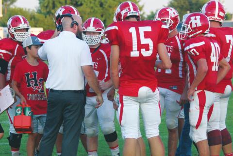 (Above) Hinton High School varsity football first-year head coach Grant Potter speaks with some of his players on Sept. 6, 2019 during a game vs. Mooreland High School. ANDREW SALMI/HINTON RECORD