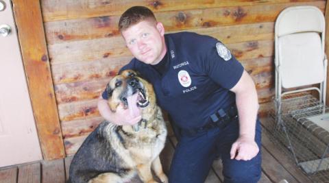Officer Shawn Kays poses with K-9 Officer Mate in this file photo from May 2021.