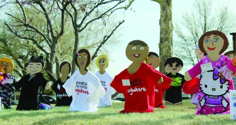 The wooden children on the Blaine County Courthouse lawn represent verified cases of child abuse in the county in the past year.