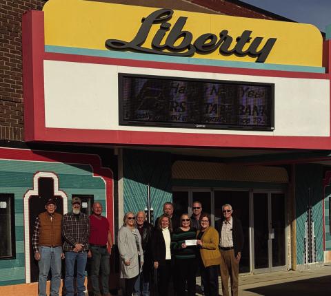 L-R, Dr. Larry Major, Josh Cox, Lane Edsall, Lisa Major-Seitter, Chub Edsall, Mark Taylor, Loren Parham, Basil Taylor, Melanie Taylor-McCrary, Denise Green and Lori Osmus. When WTC started its campaign to pay for the renovation of the front of the Liberty, First State Bank of Watonga was one of the first to support them with a donation, presenting the group with a $2500 check. Loren Parham explained that when the campaign was over, First State would give WTC another $2500 check.