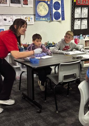 (ABOVE) Fifth and sixth grade GATE class had a wonderful guest speaker in Kenzi Haigler. She had activities that taught students how to type blood and talked about her job as a Medical Laboratory Scientist and Education Consultant. She also talked about DNA and several other fascinating topics. (AT RIGHT) A historical dinner theater will hit the boards May 1 to support
