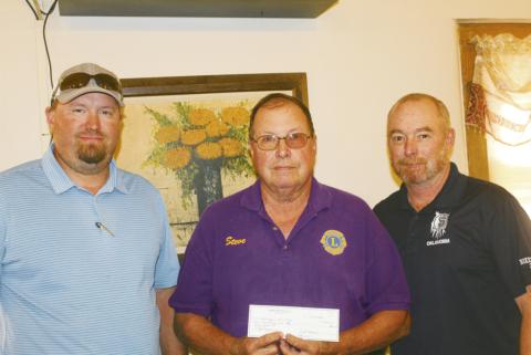 ABOVE: Kenneth Kunsman, production manager for SignalPeak Silica, Steve House of Watonga LIons Club and J.R. Hock, Singal Peak warehouse manager, display the check Signal Peak presented to the Lions for assisting in the September golf tournament to benefit local high school golfers.