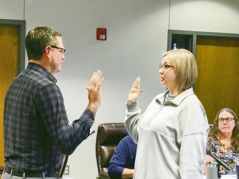 City attorney Jared Harrison (L) swears in Tara Bomhoff to serve the remainder of an unexpired term on the Watonga City Council.