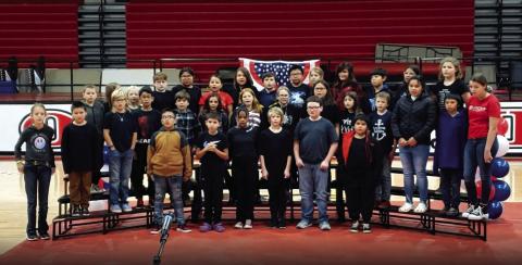 Area veterans were honored at a patriotic program Friday on Veterans' Day. Students presented songs, poems, readings, and held a flag folding ceremony. The Middle and High School band played the National Anthem, Stars and Stripes Forever, and America the Beautiful. We thank our veterans for attending, and for their service to our country. The photo features the 4th and 5th grade chorus.