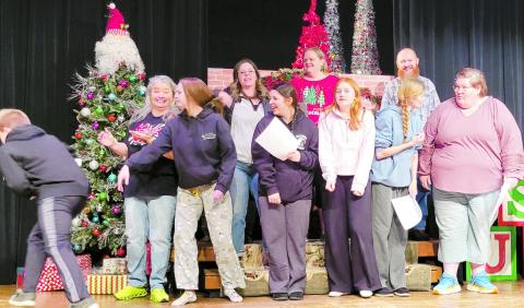 Cord Cowan, Karrie Beth Little, Jersey Wilcoxson, Taylor Coney, Delilah Fritz, Corry Rogers, Caleigh Scheihing, Kristen Ashby, Jeremiah Rogers, Amy Adams, Josh Cox, Karen Gilliland rehearse the opening scene of That's Christmas to Me which debuts at 2:30 and 7:30 p.m. Sunday, Dec. 15 and at 7:30 p.m. Monday, Dec. 16 at Watonga Community Theatre.