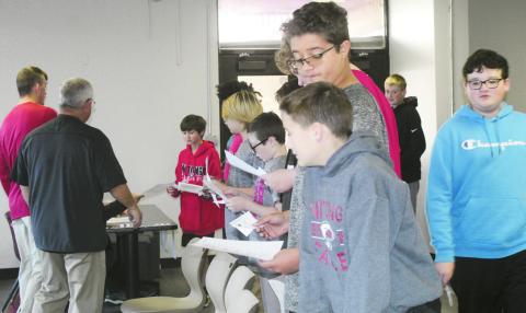 Seventh grade students at Watonga Middle School took part Tuesday in a mock election. Each student would approach the ‘poll workers’ and show their ID. Then they were given a mock ballot and sent to the voting booths. Along the way they were coached about the rules, such as not talking about who they were going to or had voted for inside the polling place.