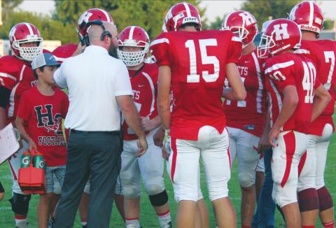(Above) Hinton High School varsity football first-year head coach Grant Potter speaks with some of his players on Sept. 6, 2019 during a game vs. Mooreland High School. ANDREW SALMI/HINTON RECORD