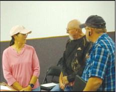 Jackie (L) and Jay Clark (C) are introduced as the new city emergency managers during a Geary Council meeting. They were brought on board by Jeff Choate (L) who is resigning as public works director for the city and is working to fill the jobs he will vacate later this month.