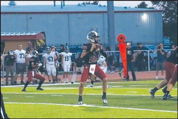 Quarter back Tristan Dobbins getting ready to make a pass.