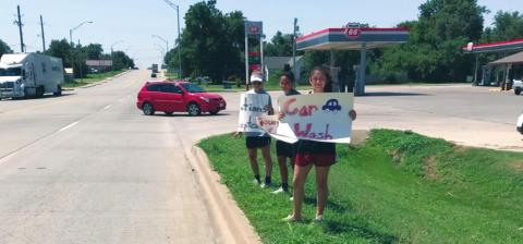 Lady Bison Softball Holds Car Wash Fundraiser