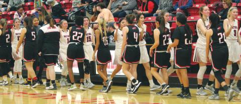The Geary High School Lady Bison and Watonga High School Lady Eagles’ varsity basketball teams shake hands on Jan. 6 following a girls’ basketball game held at Watonga Gymnasium. All OSSAA-sanctioned activities in the state of Oklahoma have been officially canceled since March 26, including the Classes 6A-2A state basketball tournaments and all 2020 spring sports seasons. Andrew Salmi | The Geary Star