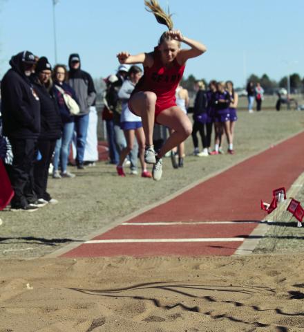 Lady Bison Mason Estep flies high in the long jump Saturday at Watonga.