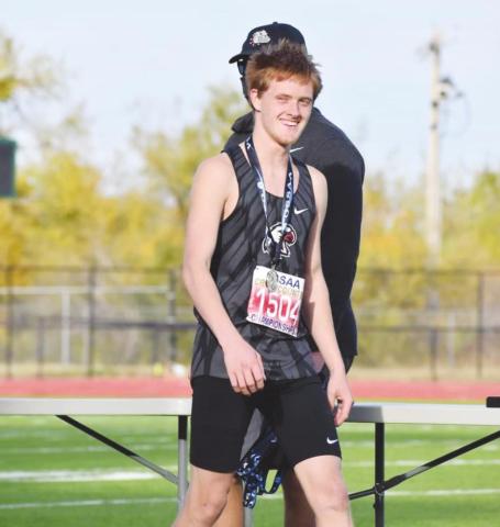 Cy Walters smiles after receiving his All-State medal. He finished seventh in the Class 2A state cross country championships.