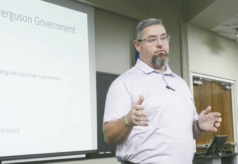 Garrett Bernethy, a member of the Hydro School Board, explains Friday to a group of area high school seniors what a board member does and why it is important to serve.