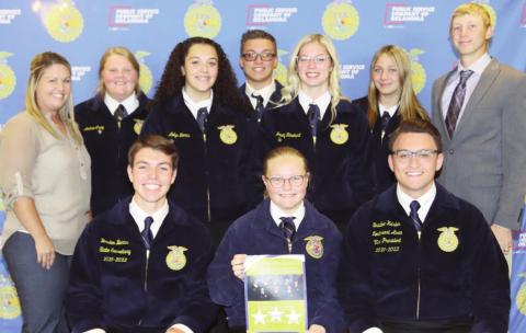 Photo left: Standing in the back are Watonga FFA officers; Sitting in the front row, far left, is Braden Burns, Kingfisher, state secretary. Sitting in the front row, far right, is Braden Heisler, Waukomis, northwest area vice-president