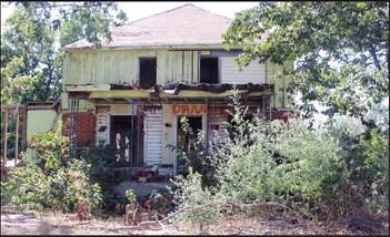 This half torn down structure in the 1000 block of Wikoff Avenue is an eyesore and has recently been the topic of complaints to the city and the county, which owns the lot due to a tax lien. Commissioner Tracy Matli has brought the matter to the commission’s attention and said resolution needs to be sooner rather tthan later.