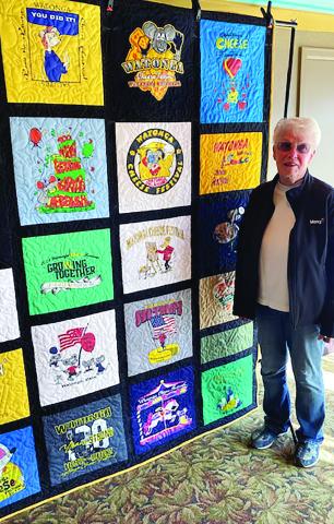 The winners of the Cheese Festival T-shirt quilt raffle were Bob Geshe, who purchased the ticket, and Karen Beirs shown above with the quilt shortly after the drawing. The raffle was a fundraiser for the Cheyenne Quilt Guild. The quilt is made from t-shirts from many previous Cheese Festivals.