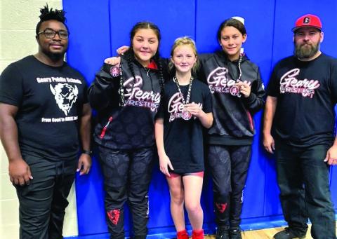 Geary Jh/Hs girls’ wrestling competed in the Holly Howard Memorial Tournament on November 21. Elliott Harrall, Olivia Helmer, and Madison Evey all placed 2nd in their weight class. Showing their tournament medals are (L-R) Elliott Harrall, Olivia Helmer, and Madison Evey.